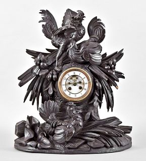 Carved Black Forest mantel clock with a French movement