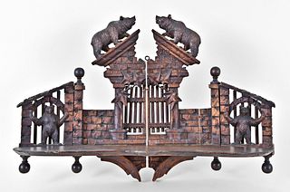 A whimsical carved architectural Black Forest folding shelf with bears