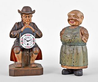 Two German Carved and Painted Wooden Figures, a Clock and a Concealed Bottle