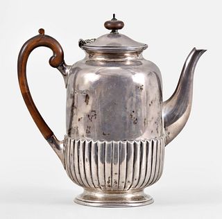 A late 19th century English sterling silver teapot by Walter and John Barnard