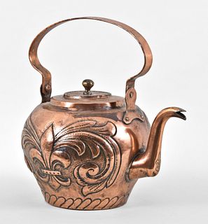 A large copper kettle with fleur de lis and gryphon repousse ornament