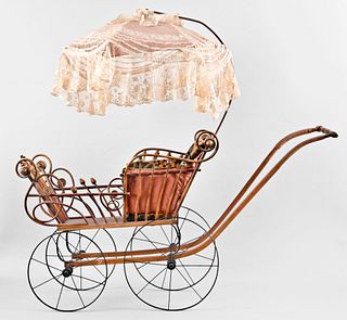 An early 20th century bent wood stick and ball doll carriage with hanging parasol