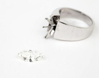 A marquise-shaped diamond and white gold band