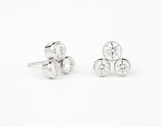 A pair of multi-diamond and white gold studs