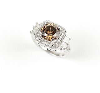 A colored diamond and white gold ring