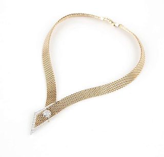 A gold mesh and diamond collar