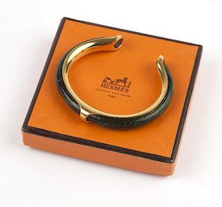 A gold-tone and dark green leather cuff, Hermes