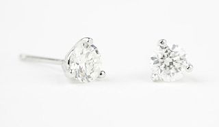 A pair of diamond and white gold studs