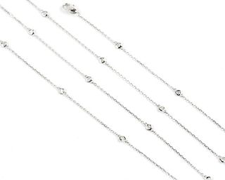 A diamond and white gold station necklace