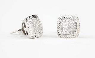 A pair of diamond and white gold square studs