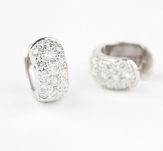 A pair of diamond and white gold huggie earrings