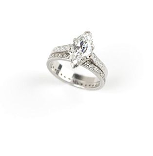 A marquise and platinum ring with eternity band