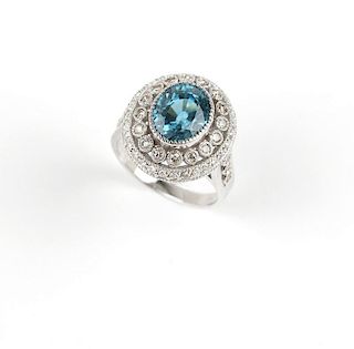 A blue zircon, diamond and white gold ring