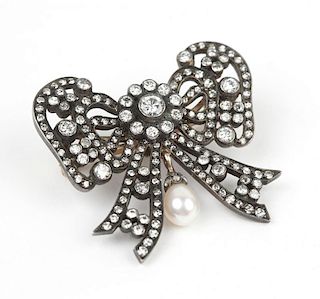 An antique diamond and pearl brooch