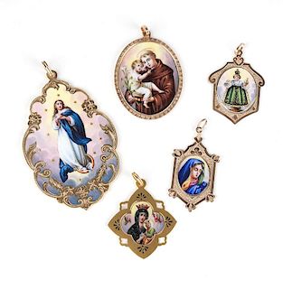A group of gold and enamel religious pendants