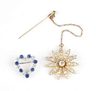 A group of two diamond brooches