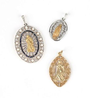 A group of gold and gem religious pendants