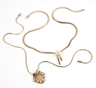 A collection of two gold and diamond necklaces