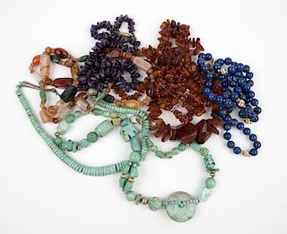 A group of stone and amber jewelry