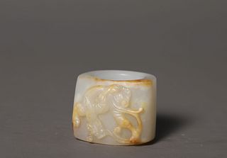 A Carved Russet Jade Chilong Thumb Ring