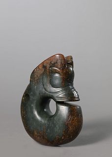 A Carved Celadon Jade Dragon Pendant