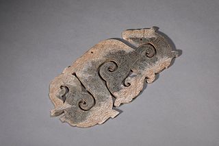 A Carved Chicken Bone Jade Dragon Ornament