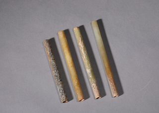 A Set of Four Chinese Carved Jade Annular Tubes