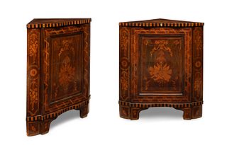 Pair of corner pieces, Louis XVI style; Holland, ca. 1780. 
Mahogany, lemonwood and ebony. 
Presents remains of polychrome in the interior.