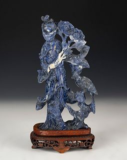 Figure of fairy with flowers and bird. China, XX century. 
Lapis lazuli hand carved on wooden base.
