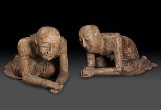 Couple of Buddhist monks. Burma, XVII-XVIII centuries. 
Carved wood. With traces of polychrome and inlaid crystals.