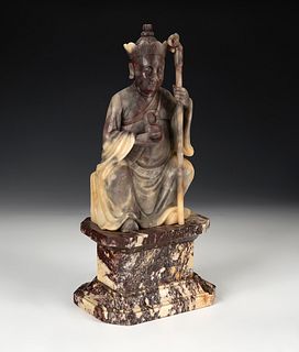 Luohan. China, XIX century. 
Hand carved soapstone on marble base.