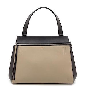 A Celine Taupe and Black Leather Edge Handbag, 14" x 11" x 7".