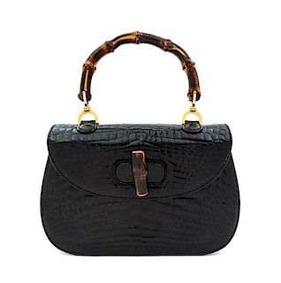 A Gucci Black Alligator Bamboo Top Handle Bag, 10.75" x 7.5" x 2.5".