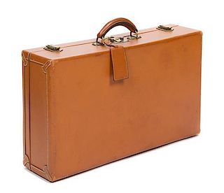 * An Hermes Brown Leather Hardsided Suitcase, 22" x 12" 5.5".