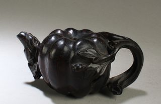 A Carved Hardwood Teapot