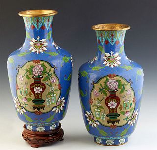 Pair of Large Chinese Cloisonne Baluster Vases, 20th c., with reserves of flower filled urns, on a blue gourd with leaf and floral decoration, H.- 15 