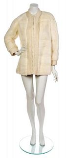 * An Ivory Fur and Cable Knit Jacket,
