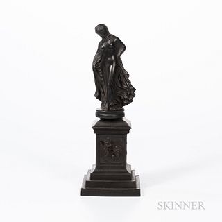 Black Basalt Figure on a Wedgwood Black Basalt Plinth, England, 19th century, standing maiden mounted atop a stepped square plinth with paneled sides,