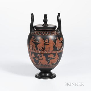 Encaustic Decorated Black Basalt Vase and Cover, England, 19th century, urn finial and upturned loop handles, iron red, black and white with two bands