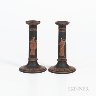 Pair of Wedgwood Encaustic Decorated Black Basalt Candlesticks, England, early 19th century, iron red, black, and white, each with a maiden and wide a