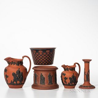 Six Rosso Antico Items, England, 19th century, each with black basalt relief, five marked Wedgwood, an oval boat form with Greek head and swan, lg. 10