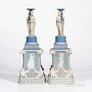 Pair of Wedgwood Jasper Figural Candlesticks on Plinths, England, 19th century, each blue and white, the candlesticks with classical maidens supportin