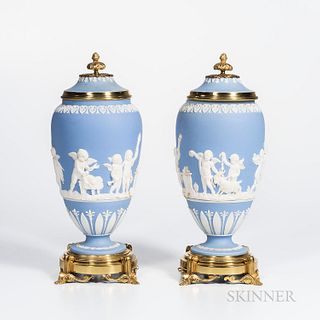 Pair of Brass Mounted Wedgwood Light Blue Jasper Vases and Covers, England, 19th century, applied white foliate borders and classical figures of child