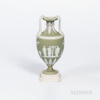 Wedgwood Green Jasper Dip Vase, England, early 19th century, applied white relief with lion masks and mane handles, classical figures and foliate bord