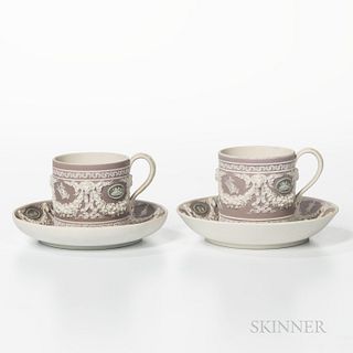 Two Wedgwood Tricolor Jasper Dip Cans and Saucers, England, 19th century, each with lilac ground, green medallions and applied white classical figures