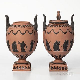 Pair of Wedgwood Terra-cotta Jasper Vases, England, each with applied black classical Muses in relief and with foliate borders and upturned loop handl