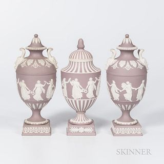 Three Wedgwood Solid Lilac Jasper Vases and Covers, England, 1960-61, each with applied white Dancing Hours in relief, a pair with Bacchus head handle