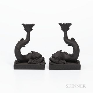 Pair of Wedgwood Black Basalt Dolphin Candlesticks, England, 1974, each mounted atop a raised rectangular base bordered with shells, impressed marks, 