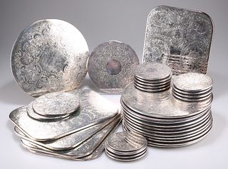 A QUANTITY OF SILVER-PLATED COASTERS AND PLACE MATS. (Qty)