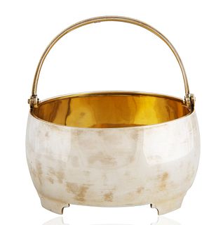 A FABERGE SILVER SUGAR BASKET WITH SWING HANDLE